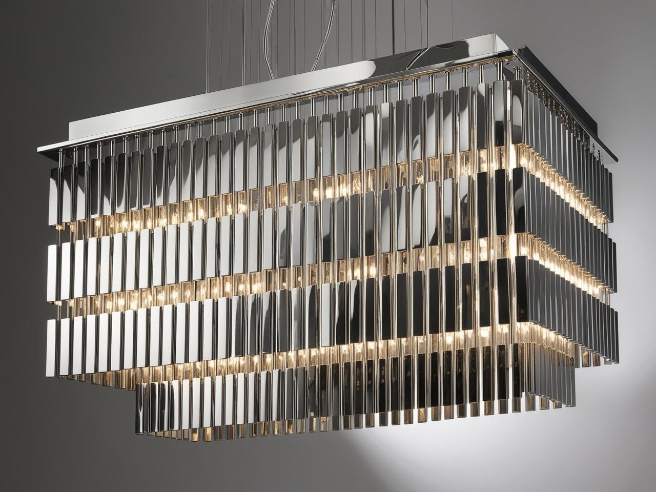 Luxurious chandelier made of stainless steel rectangles in arrays from top to bottom as it goes from top to bottom the number of rectangles decrease but remain the same size 1